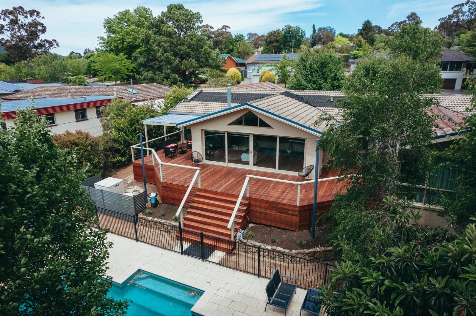 Outdoor deck and pergola by Faber Construction